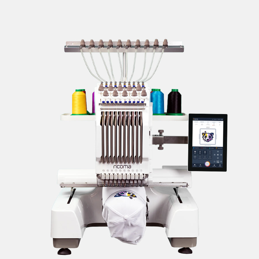 Embroidery machine with needle bar and spools of thread on a white background